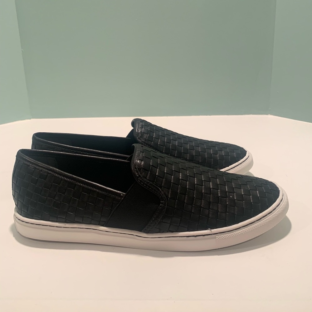 Black woven leather loafers with white sole